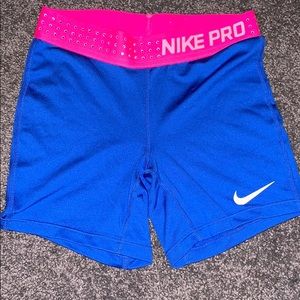 Blue with bedazzled pink belt nike pros